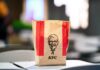 KFC takeout bag on a table in a restaurant