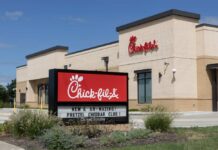 Chick-fil-A Without THIS — What’s Missing? Exterior view of a Chick-fil-A restaurant with a promotional sign