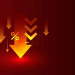 Savings Crash To 2.6% — Uh Oh Graphic representation of downward arrows and a percentage symbol on a red background