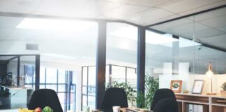 Modern conference room with wooden table and black chairs