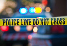 Parking Lot War At McDonald’s?! Police tape and lights at crime scene.