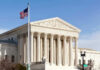 Supreme Court Greenlights Border Block U.S. Supreme Court building with American flag.