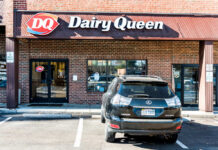 DQ Purge Shuts Dozens Overnight DQ Grill & Chill restaurant exterior with stone facade and red awnings