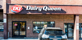 DQ Grill & Chill restaurant exterior with stone facade and red awnings