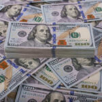 Pentagon’s $37.5B War Math Sparks Fury Stack of one hundred dollar bills, Benjamin Franklins portrait.