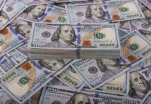 Pentagon’s $37.5B War Math Sparks Fury Stack of one hundred dollar bills, Benjamin Franklins portrait.