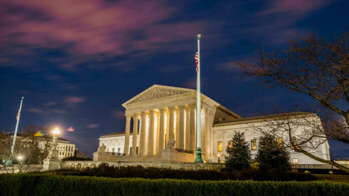 shutterstock_1355731721 The United States Supreme Court building at dusk.