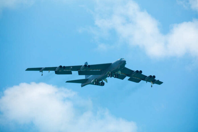 Usa.,Florida.,Miami,Beach.,May,2019:,Usaf,B-52,Bomber.,Demonstration Large military aircraft flying with landing gear down
