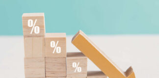 Wooden blocks with percent signs and a downward arrow