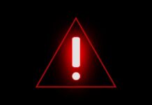 Red warning triangle with exclamation mark on black background