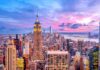 Empire State Building amid New York City skyline at sunset