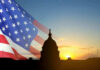 Senator’s Mystery Hospital Stay Sparks Concern U.S. Capitol silhouette with American flag and sunrise.