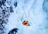 1,500-Foot Plunge — She Lived A climber ascending a frozen ice wall in a snowy landscape