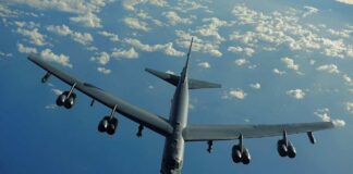 Strategic B-52 bomber aircraft flying over the ocean