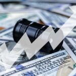 Iran Clash Chokes World Oil – Prices Skyrocket AGAIN! An oil barrel placed on a background of dollar bills with an upward trend graph overlay