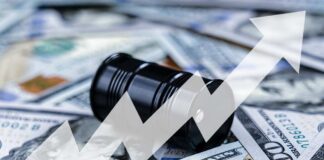 An oil barrel placed on a background of dollar bills with an upward trend graph overlay