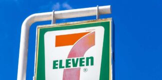 7-Eleven storefront with illuminated sign and window display