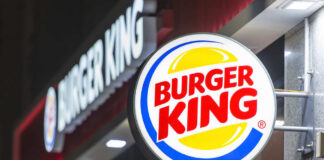Illuminated Burger King sign at night