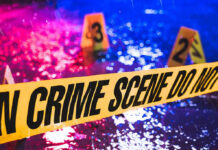 Police Officer Slain – Now She’s Dead, Too! Crime scene tape with blurred evidence markers.