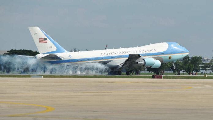 Bangkok,-,Nov,18:,Air,Force,One,Lands,At,Don Airplane labeled United States of America on runway