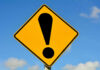 VIDEO: Gold Pit Buries, Kills Dozens Yellow caution sign with exclamation mark symbol.
