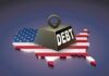 Debt Bomb Nears $2 Trillion — Again! A heavy weight labeled 'DEBT' sits on a map of the United States, symbolizing economic challenges.
