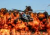 VIDEO: Apache Inferno Claims 2 Soldiers Military Apache helicopter flying through a cloud of smoke
