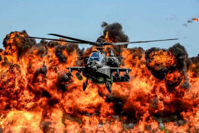 U.s.,Army,Ah-64d,Apache,Attack,Helicopter,,Assigned,To,The,1-151st Military Apache helicopter flying through a cloud of smoke