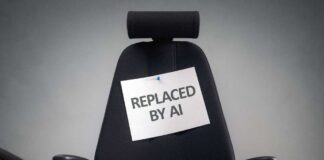 Empty office chair with a sign pinned to the backrest