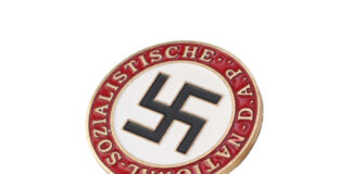 Nazi party badge with swastika on white circle and red border