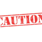 Warrantless Dragnet Exposed Nationwide Red caution sign with grunge texture diagonal