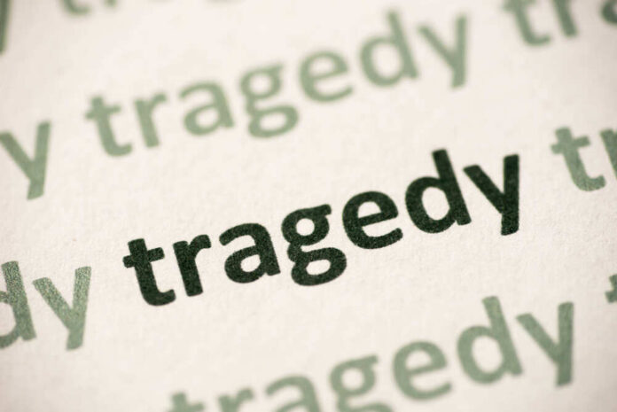 Word,Tragedy,Printed,On,White,Paper,Macro Close-up of the word 'tragedy' printed multiple times in varying shades
