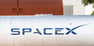 Large silver cylindrical tank with a blue logo