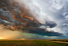 Dramatic storm clouds over a flat landscape.