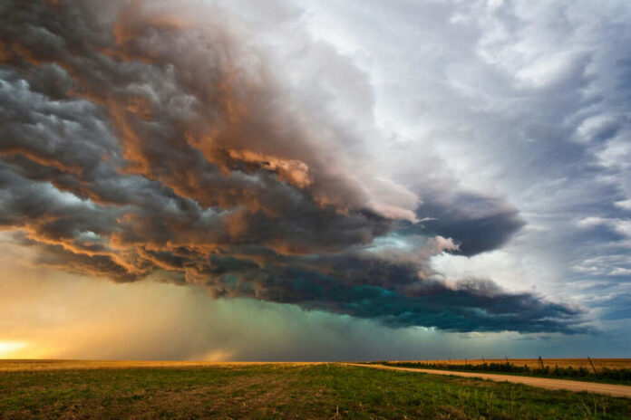 shutterstock_1694358319 Dramatic storm clouds over a flat landscape.