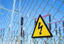 Power Plant Free-For-All Begins High voltage warning sign on a chain-link fence at an electrical substation