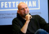 Leaked Texts Rock Fetterman John Fetterman holding microphone.