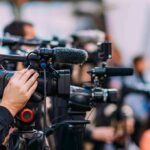 Supreme Curveball Redraws Election Day Video cameras on tripods at a media event