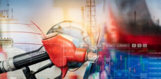 Gas pump with financial data overlay and oil refinery in the background