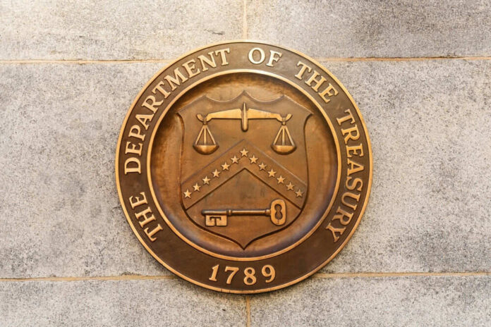 shutterstock_2272426623 Department of the Treasury seal on stone wall