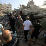 Buried Alive Eight Days — He Still Cracked A Joke People search through rubble of a collapsed building