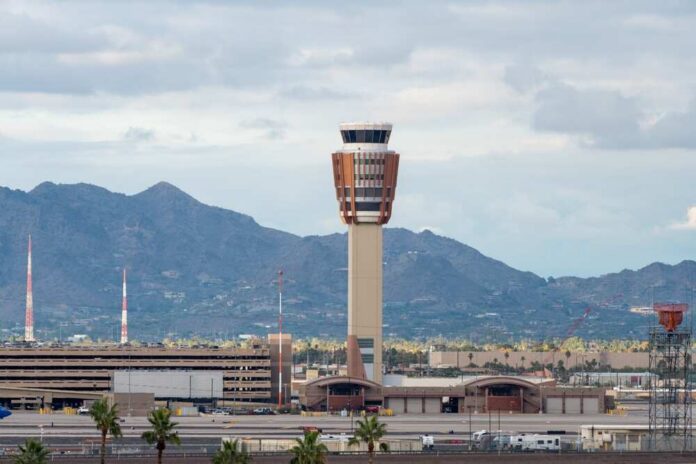 Phoenix,,Arizona,-,December,23,,2023:,Air,Traffic,Control,Tower Airport control tower with mountains in the background