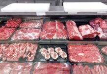 Variety of fresh meats displayed in a butcher shop
