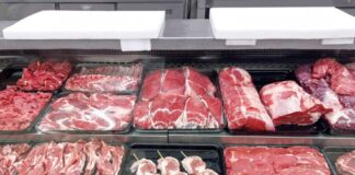 Variety of fresh meats displayed in a butcher shop