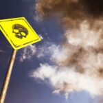 Deadly Colosseum Tragedy Sparks Urgent Probe Yellow warning sign with skull symbol under dramatic cloudy sky
