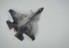 Fighter Jets Shoot Down Border Drone Fighter jet performing an aerial maneuver with smoke trailing behind