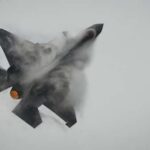 Fighter Jets Shoot Down Border Drone Fighter jet performing an aerial maneuver with smoke trailing behind