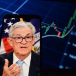 30-Year Treasury Surges: Inflation Alarm? Jerome Powell speaking on a smartphone screen with stock chart in background