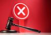 Lib State Outlaws THIS For Federal Cops?! Judge's gavel with red cross sign in background