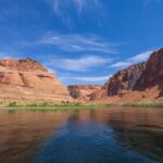 VIDEO: Deadly Wall Of Water Ambushes Iconic Trail Red rock canyon with river under a bright blue sky